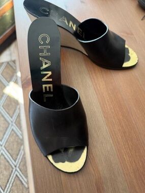 CHANEL Black Leather Open-Toe Slide Mules with Gold Accents